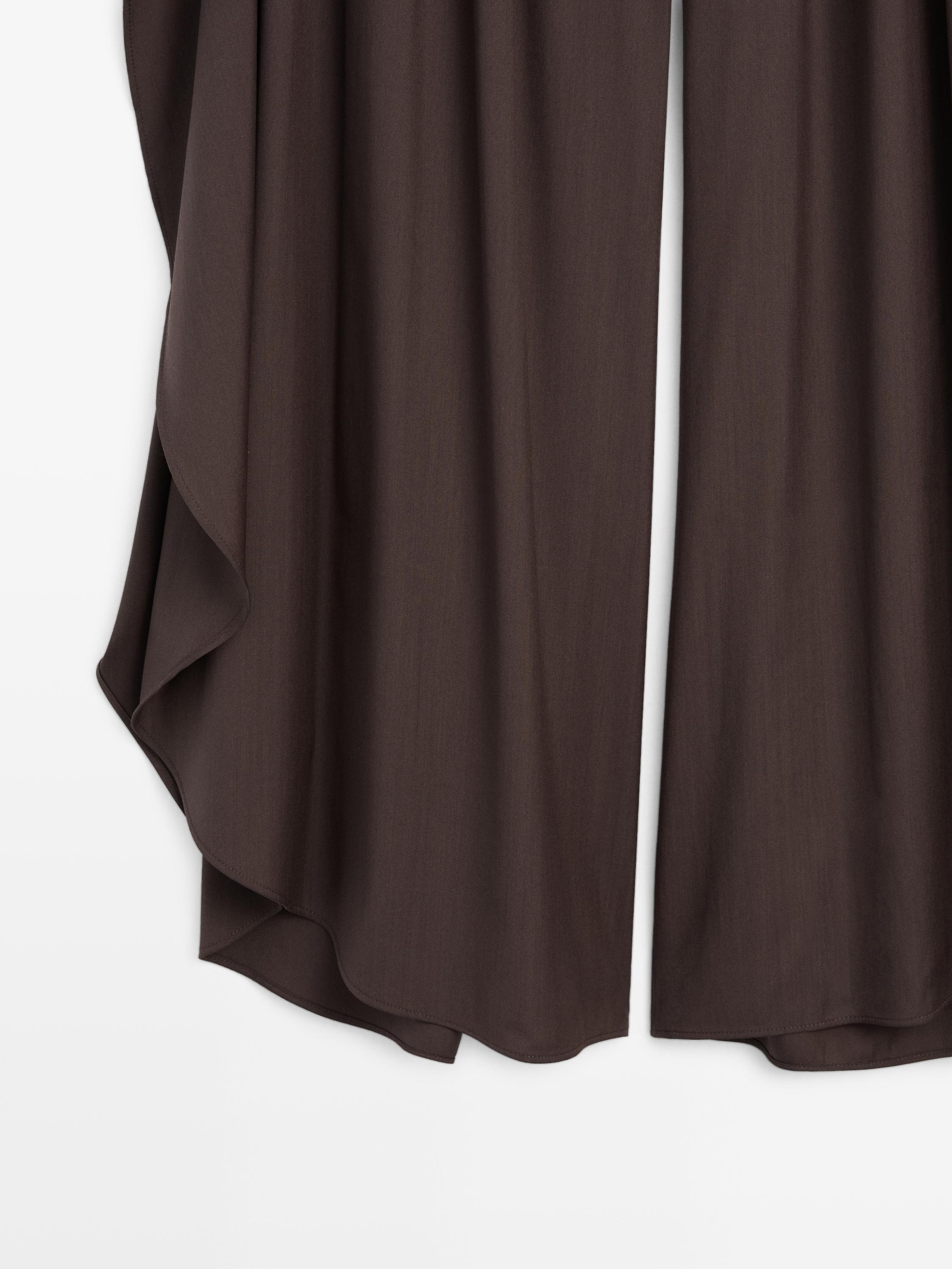 Wide-leg pleated trousers with side vents